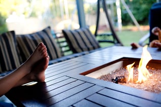 kids-sitting-around-a-patio-fire-pit-with-flames-r-BNTCGRC